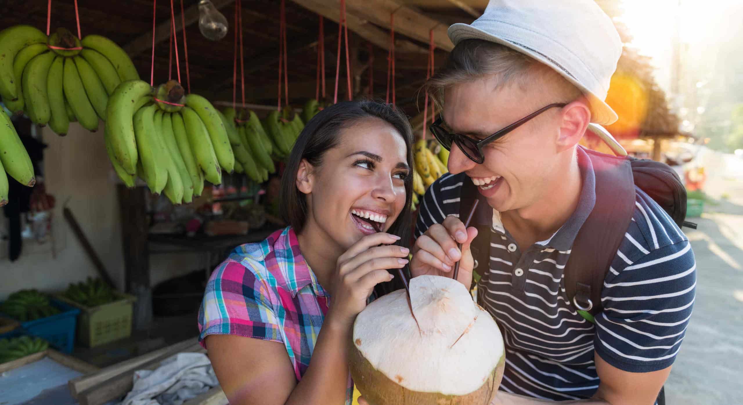 Happy Couple Drinking Coconut On Thailand Street Market