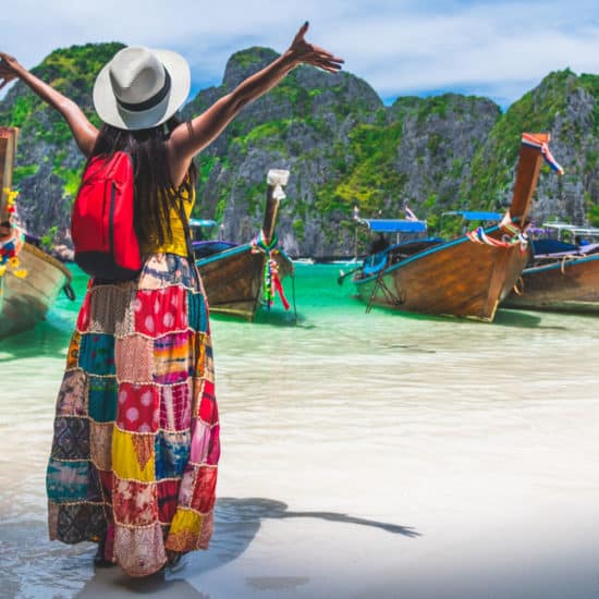 Tourist exploring Thailand island beach & boats